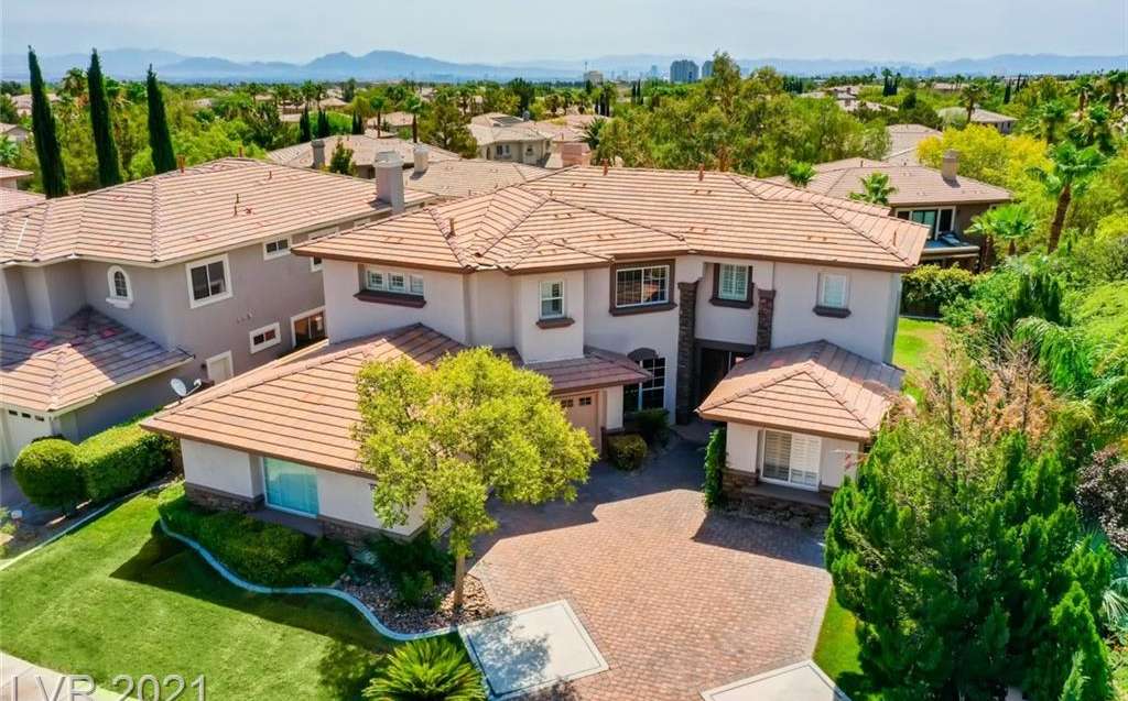 104 North Buteo Woods Lane, Las Vegas, NV 89144 in Talon Pointe in The